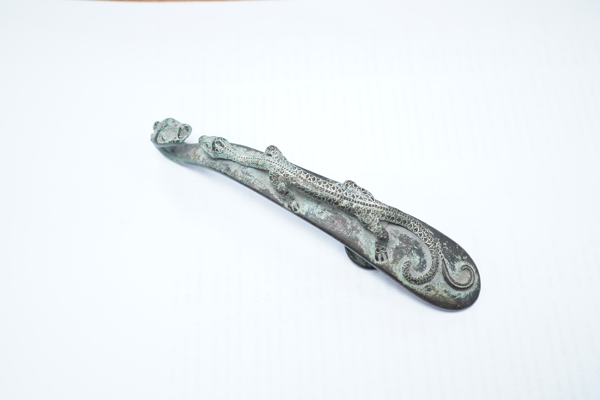 A Chinese bronze belt hook, Song Dynasty or later, 13.5cm wide. Condition - good condition for age